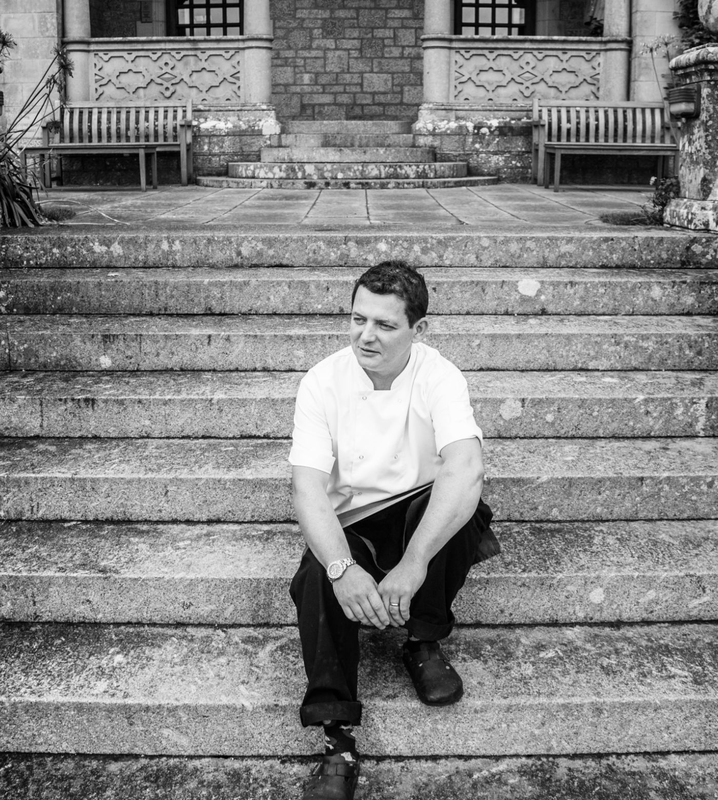 chef sitting on Bovey Castle steps 
