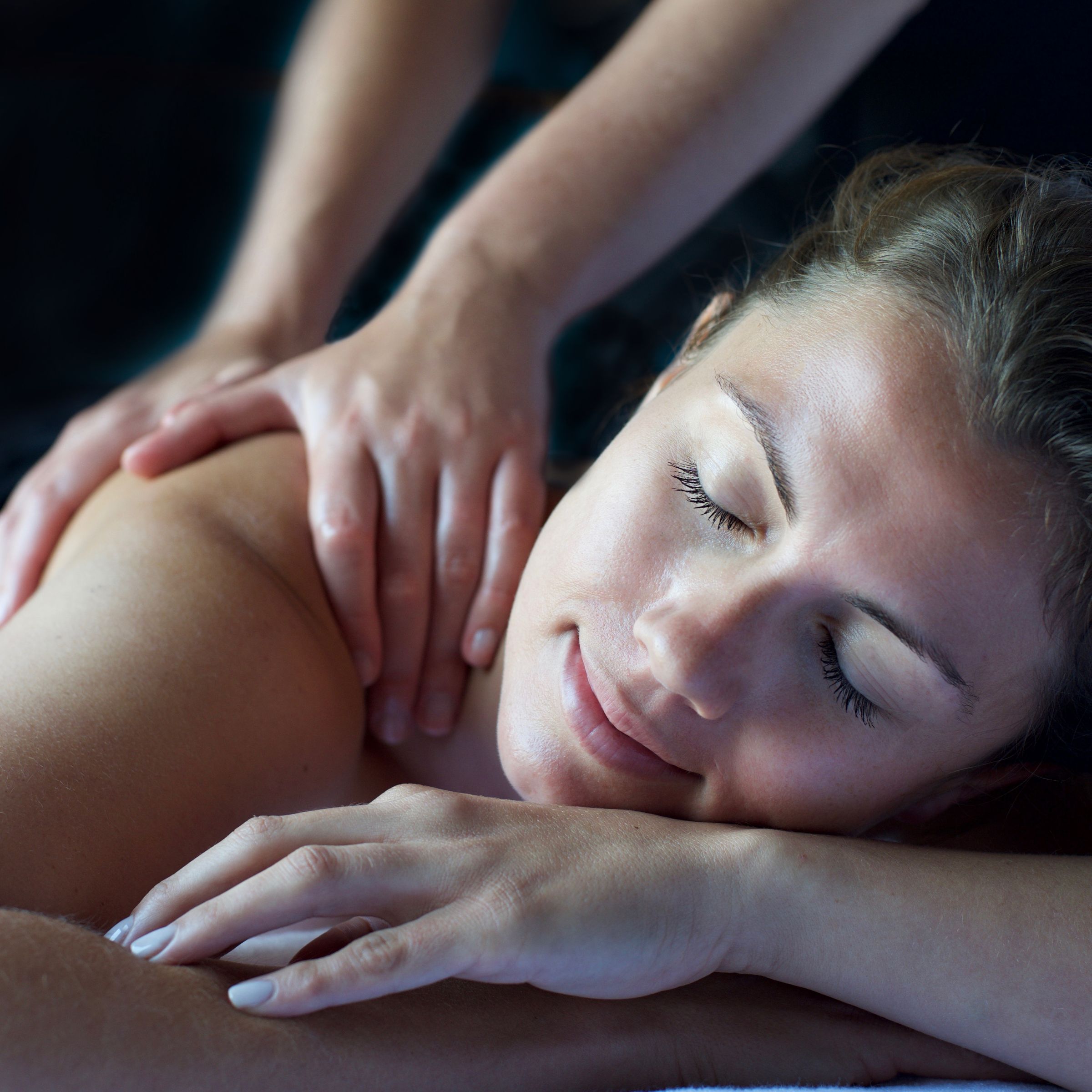 Woman receiving shoulder massage during spa break in Devon